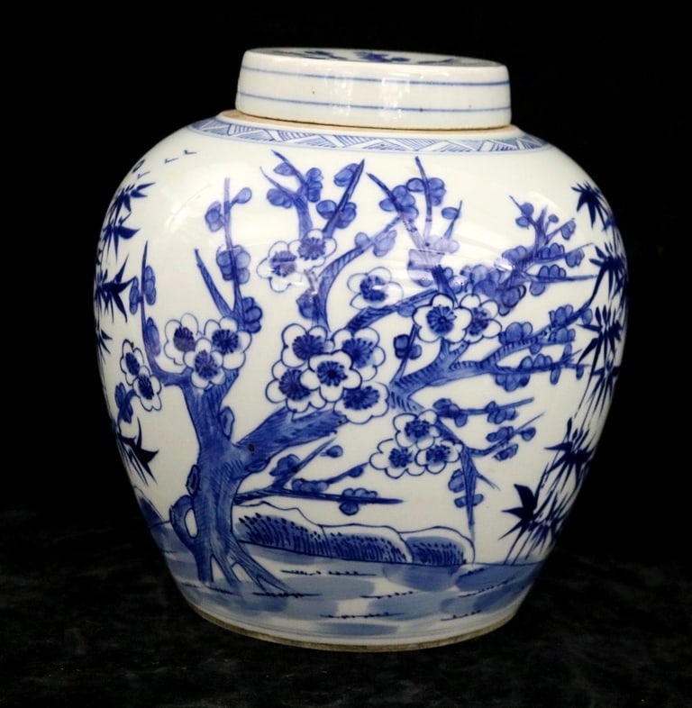 CHINESE MING-STYLE BLUE AND WHITE DECORATED PORCELAIN LIDDED GINGER JAR. 19th century. - Height: CHINESE MING-STYLE BLUE AND WHITE DECORATED PORCELAIN LIDDED GINGER JAR. 19th century. Decorated with flowering tree and bamboo, pine and plum blossoms (known as the "Three Friends of Winter"). Bird d