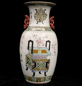 CHINESE FAMILLE ROSE BALUSTER-FORM PORCELAIN VASE DECORATED WITH SCHOLARLY MOTIFS. Qing Dynasty. -