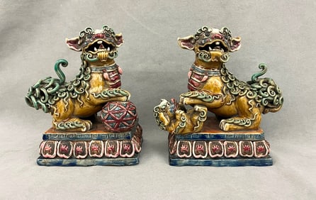 PAIR CHINESE POLYCHROMED POTTERY FIGURES OF FU DOGS, - H: 8 in.
