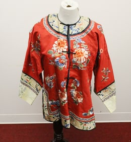 CHINESE MULTICOLOR FLORAL EMBROIDERED RED SILK JACKET, early 20th century.