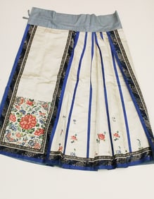 TWO CHINESE MULTI-COLOR EMBROIDERED SKIRTS, early 20th century.