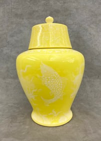JAPANESE YELLOW PORCELAIN TEMPLE JAR WITH LIFT COVER AND PATE-SUR-PATE TYPE DECORATION. - H: 13 in.