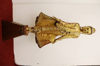 THAI CARVED AND GILT DECORATED FIGURE OF BUDDHA. Encrusted with multi-color glass sequins; on