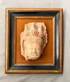 SOUTHEAST ASIAN REDDISH STONE TEMPLE FRAGMENT CARVED AS BUDDHA HEAD, - L: 9".