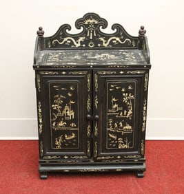 CHINESE BONE-INLAID EBONIZED WOOD TWO-DOOR CABINET. - H: 23 1/2; W: 15 3/4"; D: 7 3/4".