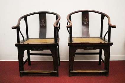 PAIR CHINESE CARVED ELMWOOD HORSESHOE-BACK OPEN ARMCHAIRS WITH INSET CANED SEAT PANELS. Floral