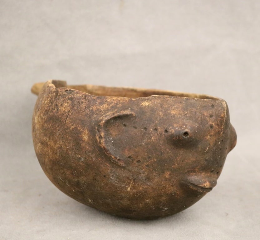 CONGOLESE WOODEN SHI (BASHI) PITCHER. - Height: 4.25 inches.: CONGOLESE WOODEN SHI (BASHI) PITCHER. Carved pitchers serves practical purposes within the Shi community, primarily for serving local beverages like wine or beer, as well as for ritual drinks. The Sh