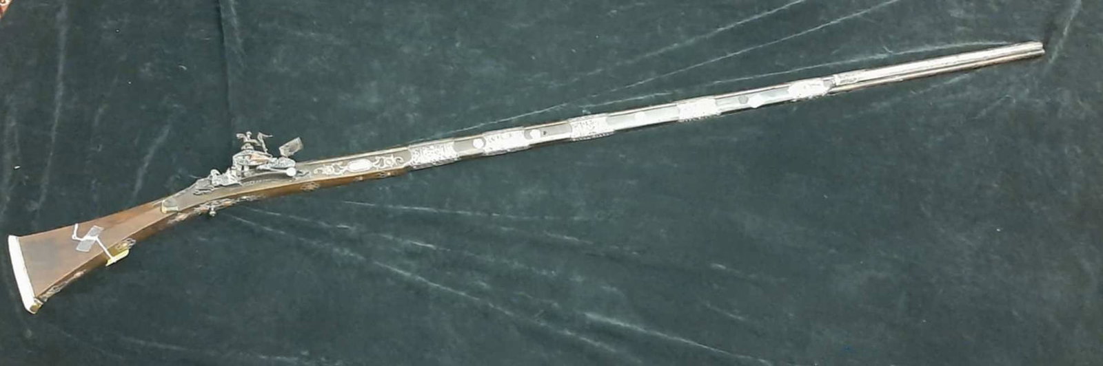 ANTIQUE TIBETAN RIFLE, MATCHLOCK MUSKET, - L: 67 in.: ANTIQUE TIBETAN RIFLE, MATCHLOCK MUSKET. Applied with silver ornamentation and coral cabochons - L: 67 in.