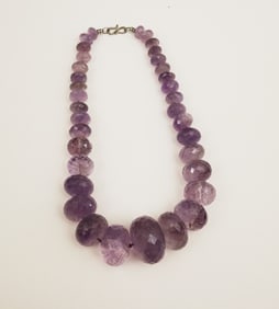 GRADUATED, FACETED AMETHYST JUMBO BEAD NECKLACE.