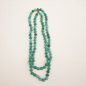 DOUBLE-STRAND MATCHED TURQUOISE BEAD NECKLACE WITH 14K YELLOW GOLD, SAPPHIRE AND DIAMOND CLASP.