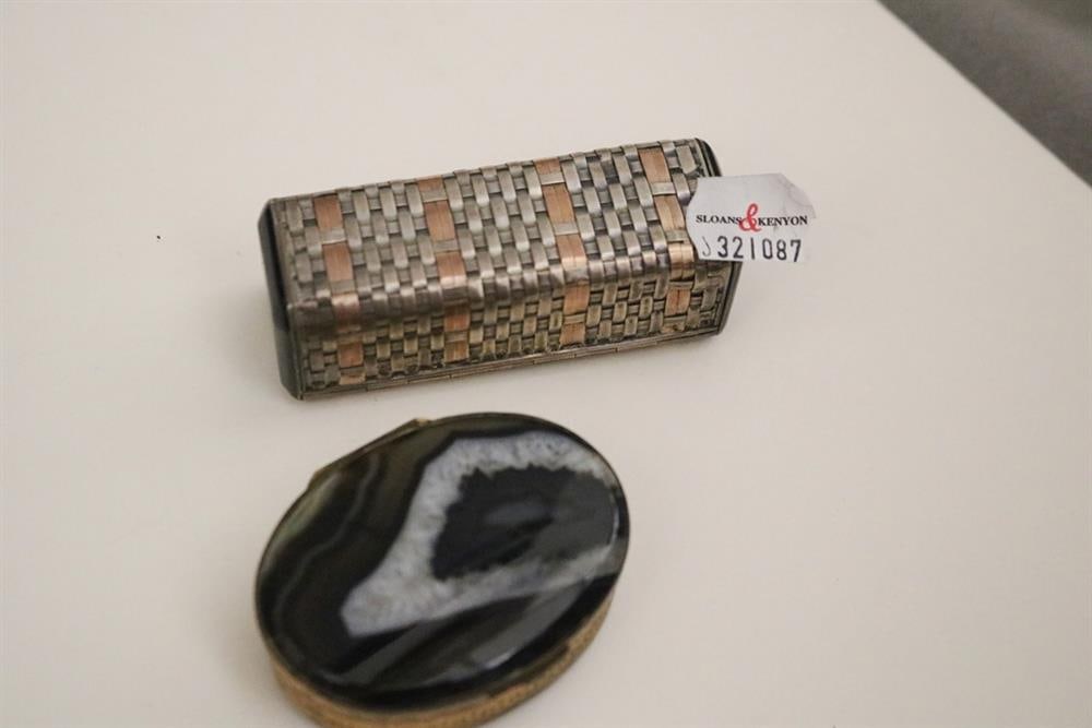 SIGNED CARTIER STERLING SILVER, ROSE GOLD HINGED-TOP PILL BOX AND A GILT-SILVER AND STRIATED: SIGNED CARTIER STERLING SILVER, ROSE GOLD HINGED-TOP PILL BOX AND A GILT-SILVER AND STRIATED BROWN/BLACK AGATE OVAL PILL BOX, Rectangular Cartier box has silver and gold basket-weave construction wit