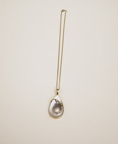 ARTISAN-CRAFTED, YELLOW GOLD MOUNTED MABE PEARL DROP-FORM PENDANT ON CHAIN.