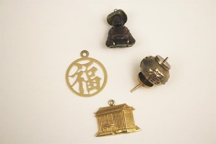 FOUR YELLOW GOLD CHINESE-THEME PENDANTS/CHARMS.