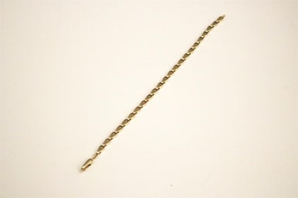 14K BRIGHT POLISHED YELLOW GOLD FLEXIBLE LINK BRACELET.