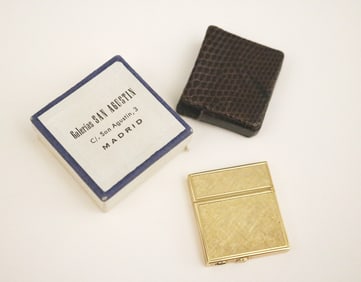 14K TEXTURED YELLOW GOLD RECTANGULAR LIGHTER. Made by Lang. - 1 1/4" x 1 1/8". Gross wt: 13 dwt.