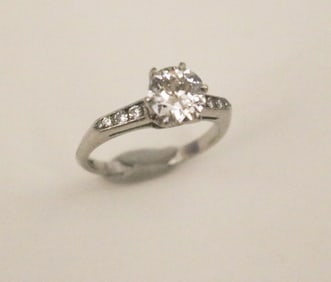 PLATINUM (10% IRIDIUM) AND DIAMOND ENGAGEMENT TYPE RING.