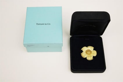 SIGNED TIFFANY & CO. 18K (750) TEXTURED YELLOW GOLD FIVE-PEARL FLOWERHEAD BROOCH.