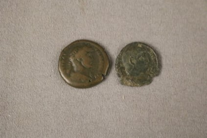TWO ANCIENT ROMAN COINS.