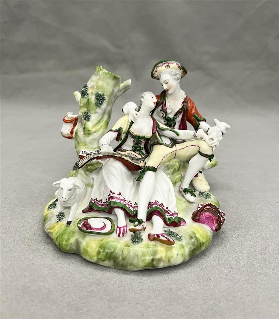 CONTINENTAL POLYCHROMED PORCELAIN FIGURE GROUP MODELED AS 18TH CENTURY COUPLE COURTING IN LANDSCAPE (1 of 7)