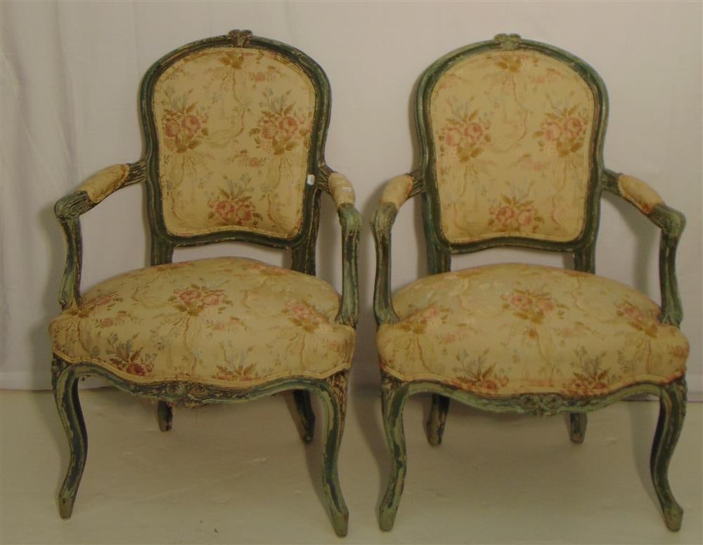 PAIR LOUIS XV CARVED AND GREEN-PAINTED FAUTEUILS WITH FLORAL FABRIC UPHOLSTERY. Carved and molded: PAIR LOUIS XV CARVED AND GREEN-PAINTED FAUTEUILS WITH FLORAL FABRIC UPHOLSTERY. Carved and molded frames; carved cabriole legs.