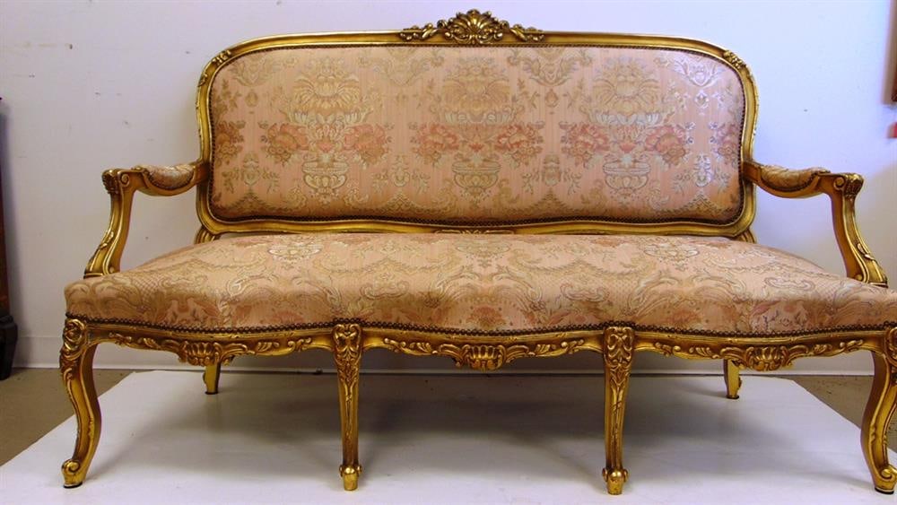 LOUIS XV CARVED AND GILT-WOOD SIX-LEG CANAPE. - W: 65 1/2 in.: LOUIS XV CARVED AND GILT-WOOD SIX-LEG CANAPE. Shell-carved crest , serpentine seat outline, floral tapestry type brocade upholstered back panel, seat and armrests; brass nailhead trim. - W: 65 1/2 in