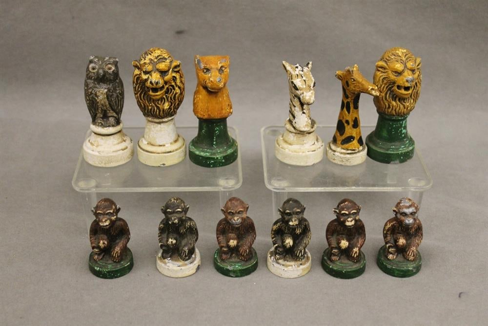 ANTIQUE ITALIAN PAINTED IRON 32-PIECE CHESS SET CAST AS MEMBERS OF THE ANIMAL KINGDOM, - Tallest, H:: ANTIQUE ITALIAN PAINTED IRON 32-PIECE CHESS SET CAST AS MEMBERS OF THE ANIMAL KINGDOM. Including lions as kings and monkeys as pawns. - Tallest, H: 3 1/8 in.
