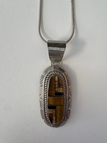 SOUTHWEST NATIVE AMERICAN HEAVY STERLING SILVER AND TIGER EYE MOSAIC OVAL PENDANT SIGNED "LLL",