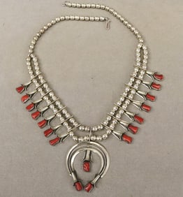 SOUTHWEST NATIVE AMERICAN STERLING SILVER AND RED CORAL SQUASH BLOSSOM NECKLACE,
