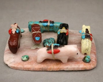 SIX ZUNI NEW MEXICO HAND-CARVED ANIMAL FETISHES ARRANGED ON A BASE, - Base 4.5 x 3.5 inches.