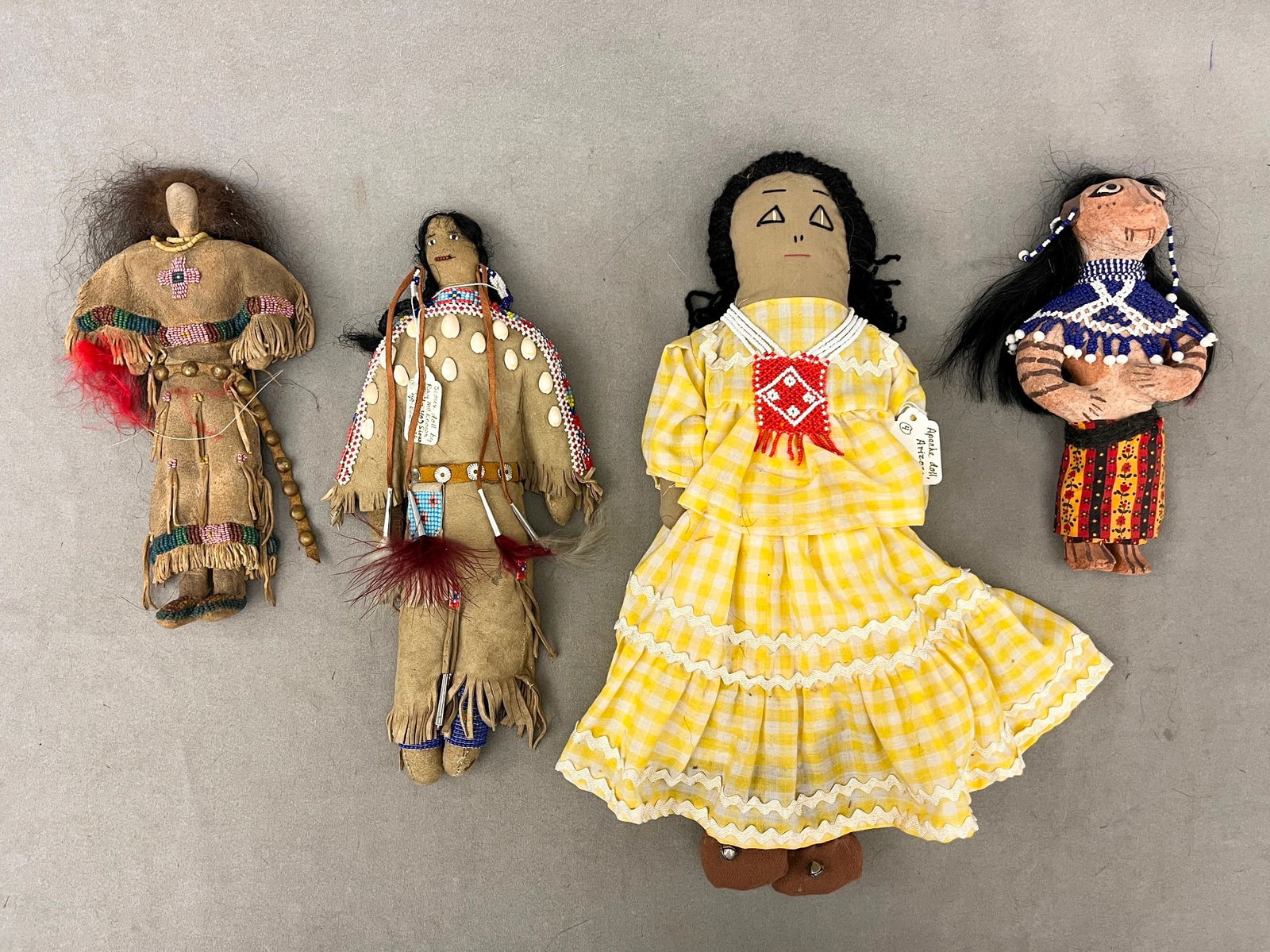 FOUR ASSORTED PLAINS AND SOUTHWEST REGIONS NATIVE AMERICAN DOLLS, - Tallest doll (Yellow dress): 17 (1 of 20)