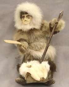 DOLL DEPICTING AN INDIGENOUS PERSON FROM THE ARCTIC OR SUBARCTIC REGION. - Height: 11.75 inches.