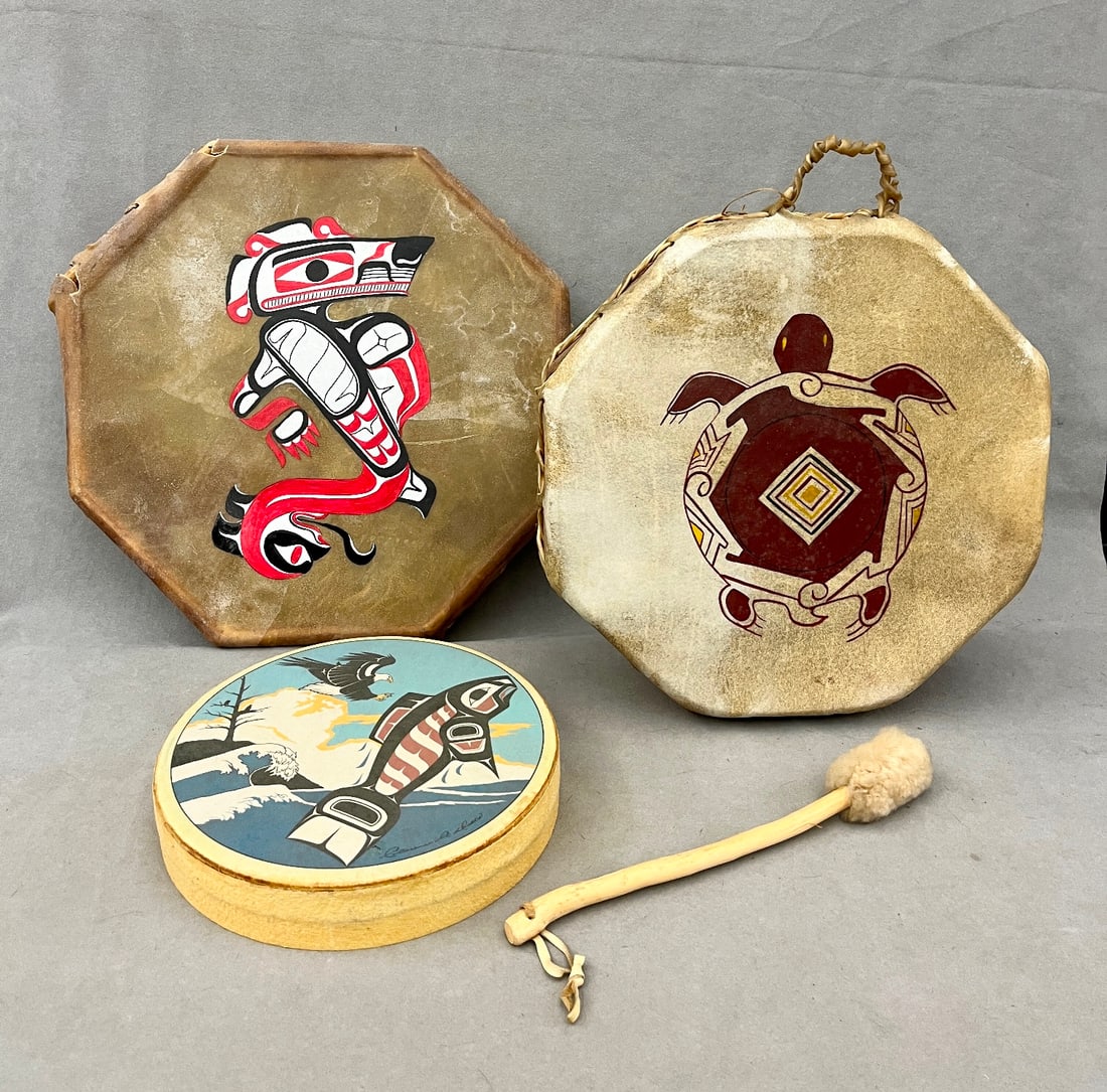 THREE HAND DRUMS THAT FEATURE TRADITIONAL NATIVE AMERICAN/FIRST NATIONS ICONOGRAPHY,: THREE HAND DRUMS THAT FEATURE TRADITIONAL NATIVE AMERICAN/FIRST NATIONS ICONOGRAPHY. Three hand drums that feature traditional Native American/First Nations iconography. Octagonal Drum with Turtle (To