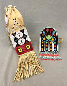 TWO ASSORTED NATIVE AMERICAN BEADED AND FRINGED POUCHES. - Length: (small bag): 19 inches.