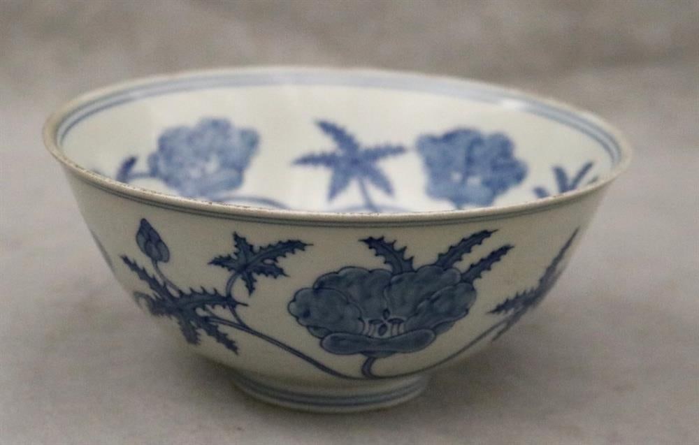 CHINESE BLUE AND WHITE PORCELAIN BOWL. - D: 5 7/8 in.: CHINESE BLUE AND WHITE PORCELAIN BOWL. Interior and exterior with trailing, flowering vine decoration; ring foot; six-character mark under foot - D: 5 7/8 in.