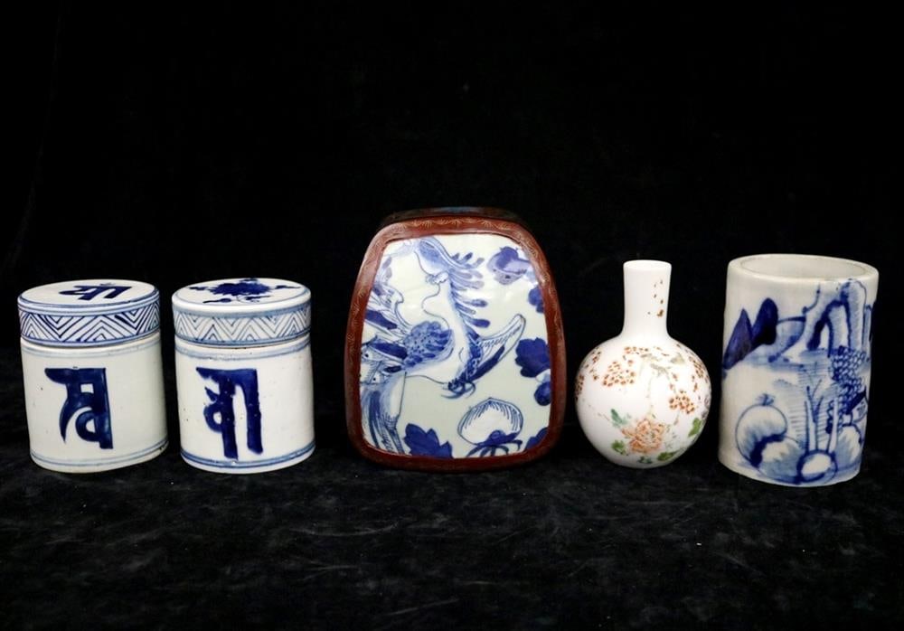 FIVE ASSORTED CHINESE BLUE AND WHITE PORCELAIN DECORATIVE OBJECTS. - Height: average: 4.5 inches.: FIVE ASSORTED CHINESE BLUE AND WHITE PORCELAIN DECORATIVE OBJECTS. First, near pair lidded blue and white containers with large Tibetan or Sanskrit script characters on sides; second, deep red or cin