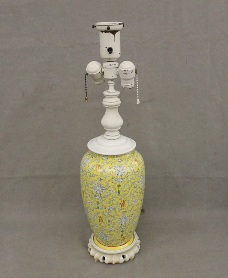 CHINESE FAMILLE JAUNE PORCELAIN BALUSTER-FORM VASE MOUNTED AS TWO-LIGHT TABLE LAMP. - Vase portion,: CHINESE FAMILLE JAUNE PORCELAIN BALUSTER-FORM VASE MOUNTED AS TWO-LIGHT TABLE LAMP. Overall floral, arabesque, tassel and character motifs - Vase portion, H: 11 1/2 in.