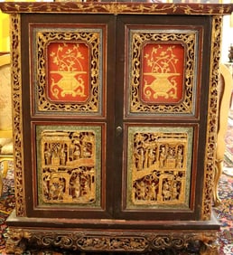 CHINESE CARVED AND PAINTED TWO-DOOR CABINET WITH GILT DECORATION, 19th century. - H: 49 in.; W: 42