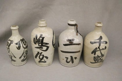 GROUP FOUR JAPANESE CERAMIC SAKE BOTTLES WITH PAINTED CHARACTER MARKS, - Tallest, H: 10 1/2 in.