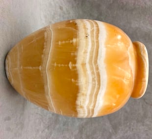 EGYPTIAN ANCIENT TRAVERTINE ALABASTER JAR. - Height: 10.25 inches; opening is 2.5 inches.