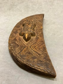 CONGOLESE KUBA TUKULA DECORATED CRESCENT-SHAPED BOX. - Height approximately: 16 inches.