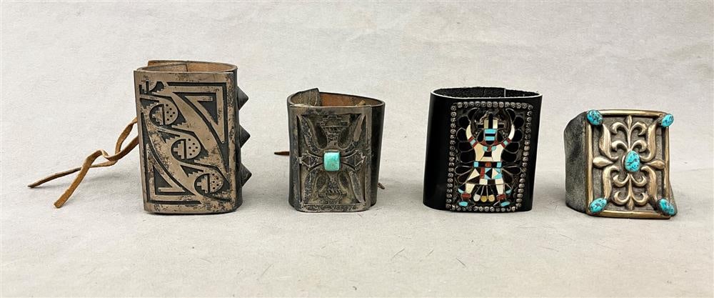 FOUR ASSORTED TRADITIONAL SOUTHWESTERN NATIVE AMERICAN SILVER AND OTHER LEATHER BRACELETS. (1 of 20)