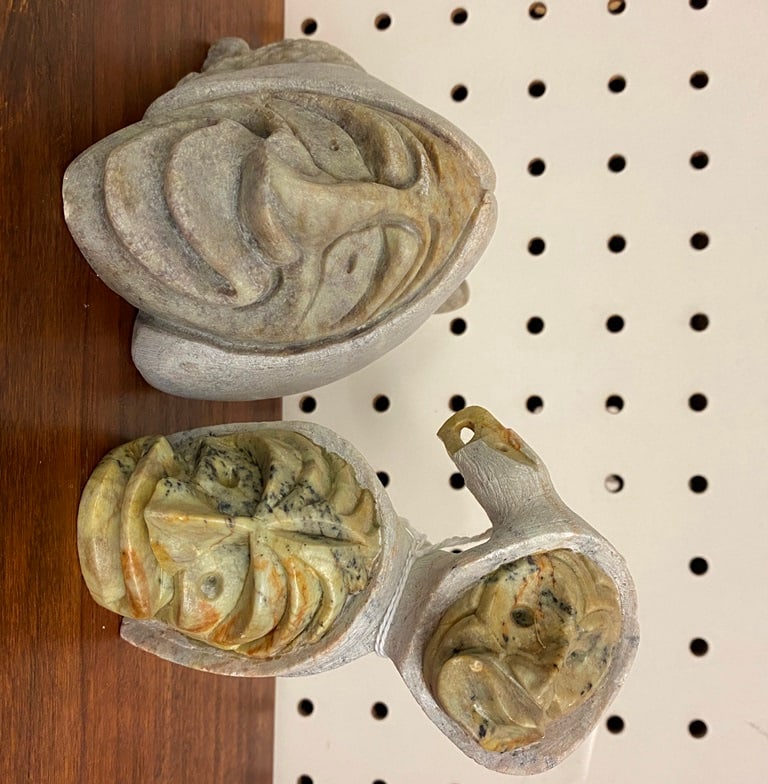 TWO IROQUOIS (HAUDENOSAUNEE) SOAPSTONE CARVINGS, FALSE FACE SOCIETY TRADITION. - heigth: 4.5 inches: TWO IROQUOIS (HAUDENOSAUNEE) SOAPSTONE CARVINGS, FALSE FACE SOCIETY TRADITION. Pair of soapstone carvings. Artist signed at the base. - heigth: 4.5 inches (tallest carving).