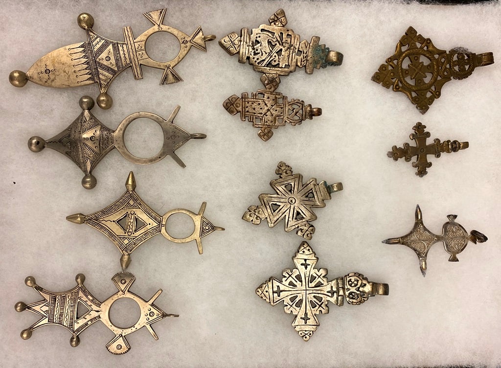 ELEVEN ASSORTED ETHIOPIAN COPTIC CROSSES AND TUAREG (OR NIGER) TANAGHILT, (1 of 20)