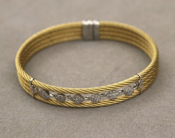 SIGNED CHARRIOL 18K WHITE GOLD, GILT-STEEL AND DIAMOND FLEXIBLE OVAL CABLE DESIGN CUFF BRACELET. -