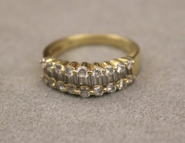 18K YELLOW AND WHITE GOLD AND DIAMOND BAND. - Ring size: 6 1/2. Gross wt. 3 dwt.