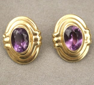 PAIR 14K BRIGHT-POLISHED MOLDED OVAL CLIP-BACK EARRINGS. - L: 1 1/4". Gross wt.: 4 dwt.