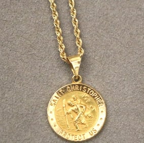 14K YELLOW GOLD ST. CHRISTOPHER MEDAL SUSPENDED ON 14K YELLOW GOLD ROPE CHAIN.