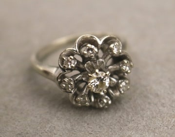 14K WHITE GOLD AND DIAMOND FLOWERHEAD DESIGN RING. - Size: 6 1/2. Gross wt. 4 dwt.
