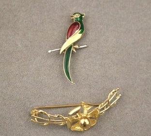 TWO YELLOW GOLD PINS.