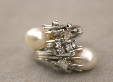 WHITE GOLD, DIAMOND AND BAROQUE PEARL BY-PASS/CROSS-OVER DESIGN RING,